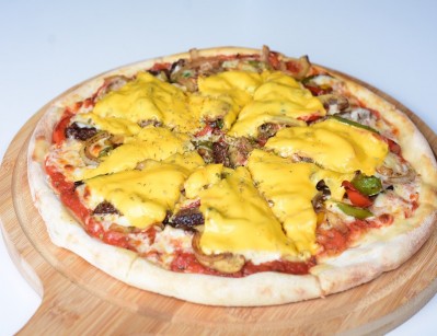 Pizza stuffed with meat and vegetables