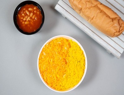 A plate of A plate of rice with broth/sauce.